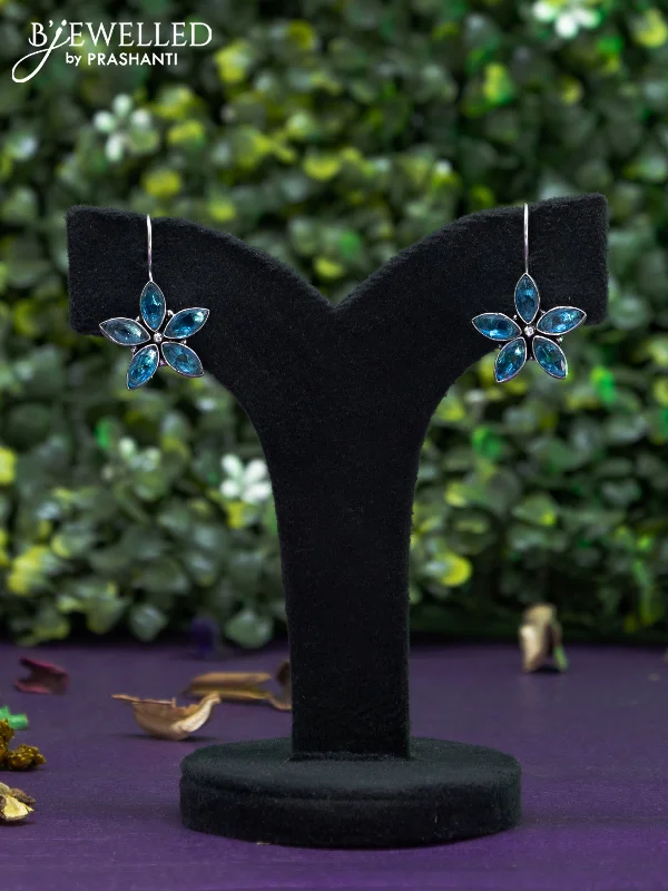 luxury gold earrings -Oxidised hanging type earring floral design with ice blue stones