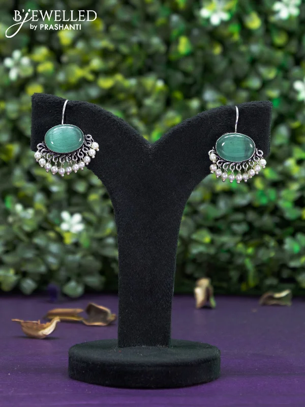 trendy stud earrings for women -Oxidised hanging type earring with mint green stones and pearl hanging