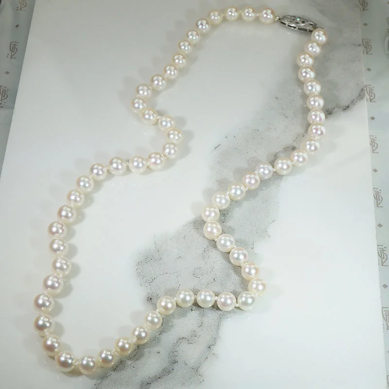 charm necklaces for women -Matinee Length Pearl Necklace with Decorative Diamond Clasp