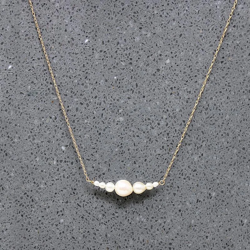 luxury fashion necklaces for women -Glowing Pearl & Gold Arc Necklace by brunet